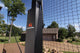 Goalrilla basketball goal in a backyard with trees and house in the background