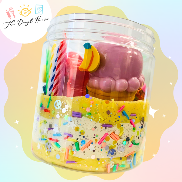 Birthday play dough jar with party-themed trinkets for kids