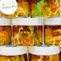 Handmade dinosaur sensory play jar for toddlers